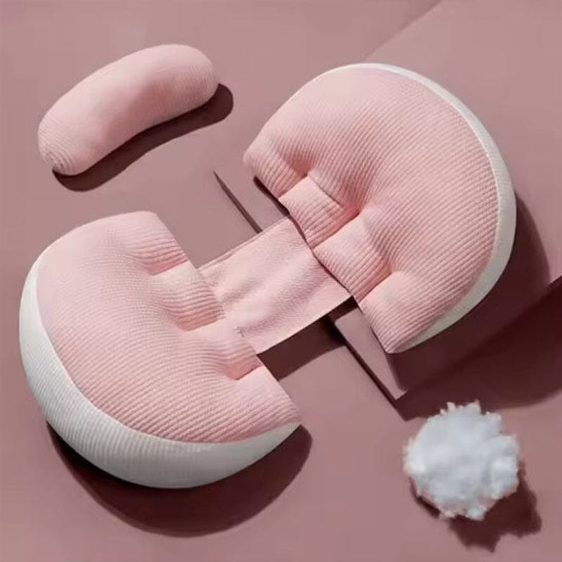 Coussin de grossesse ergonomique en forme de U couleur rose poudré avec bordures blanches, texture côtelée premium, présenté avec rembourrage coton