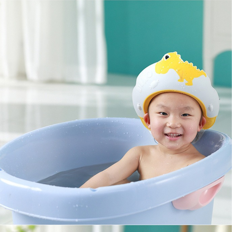 Bonnet de bain bébé Dino Soleil jaune lumière, design ludique dinosaure, matériaux premium pour confort optimal
