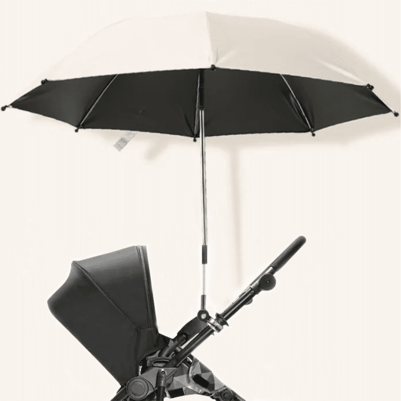 Parapluie pare-soleil premium blanc et noir fixé sur poussette avec mécanisme de fixation robuste pour protection UV